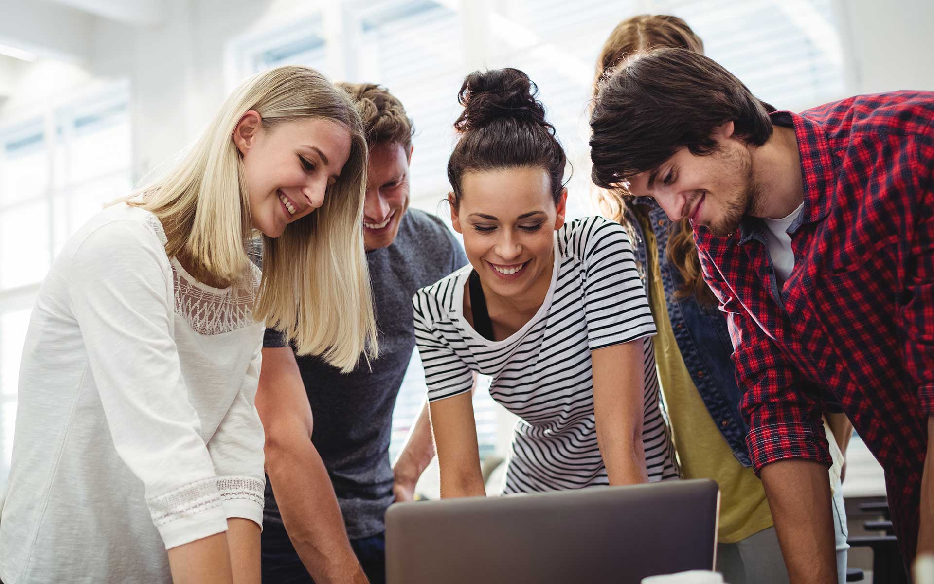 a group of individuals working together in an IT company